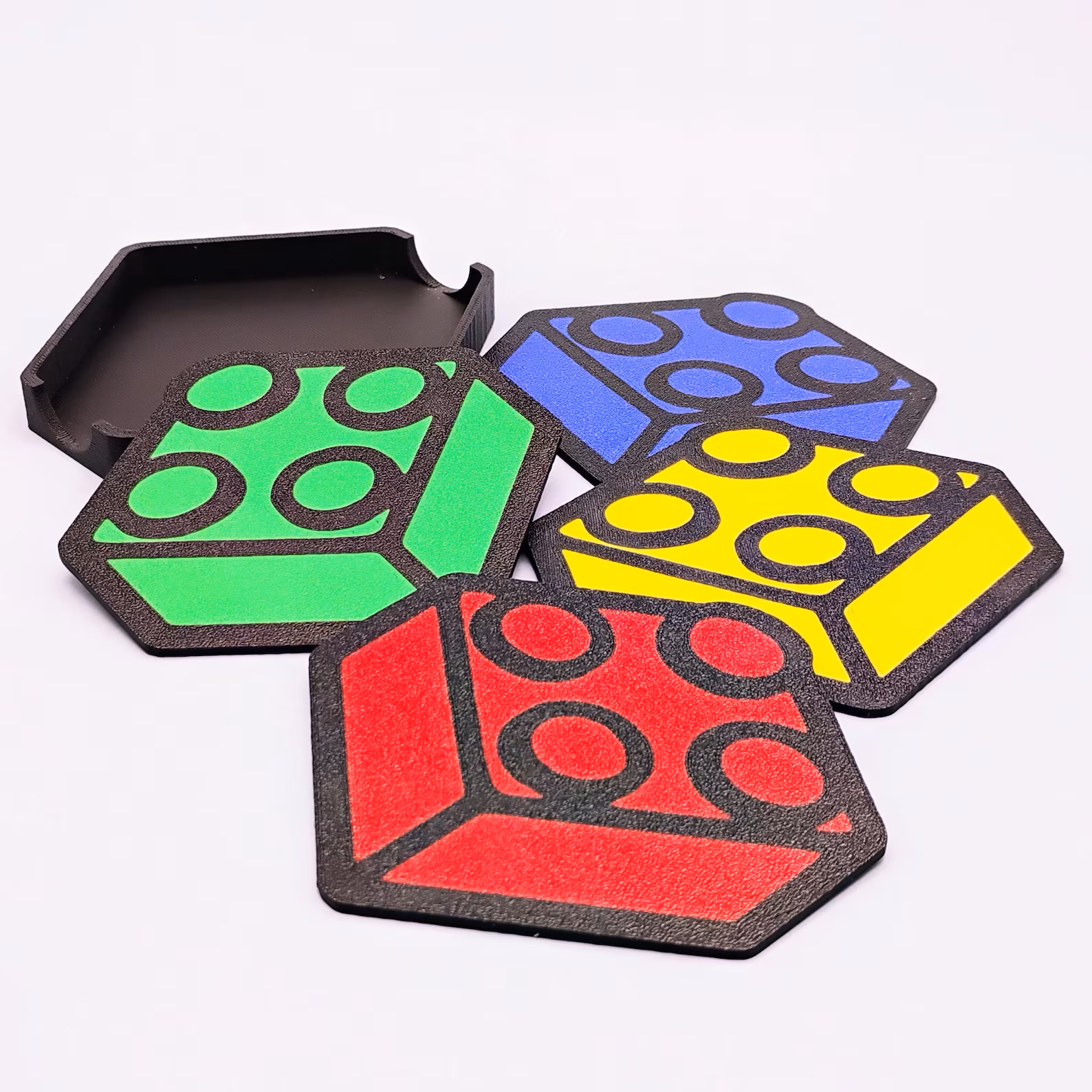 Brick-themed coaster set stacked together showing a stud-style design with matching holder.