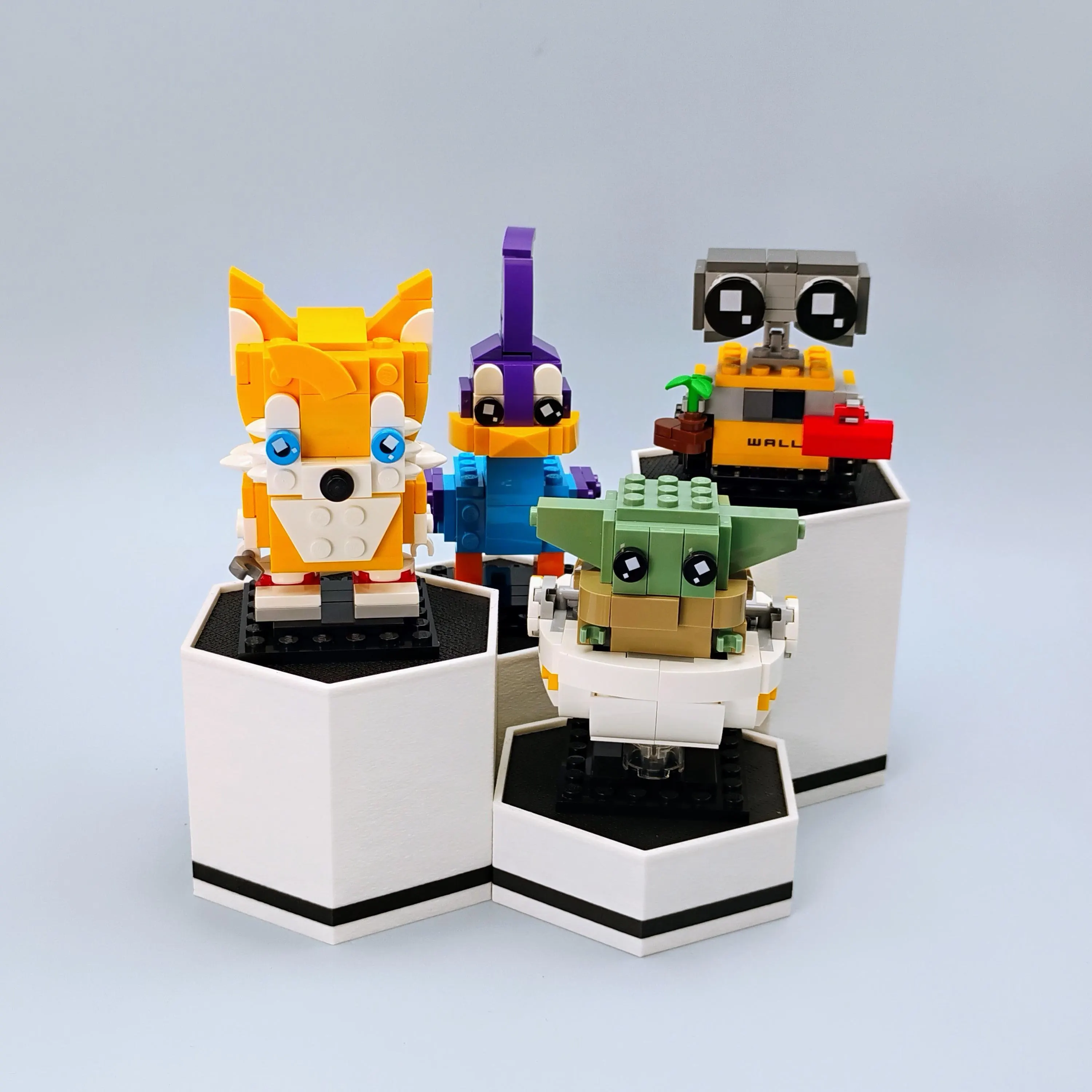 Close-up of hexagonal BrickHeadz display stands showing clean matte finish and geometric alignment.